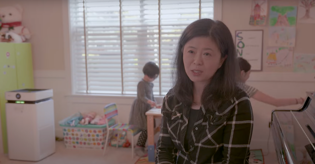 dr zhu talking with her children and airdog x8 air purifier in the background