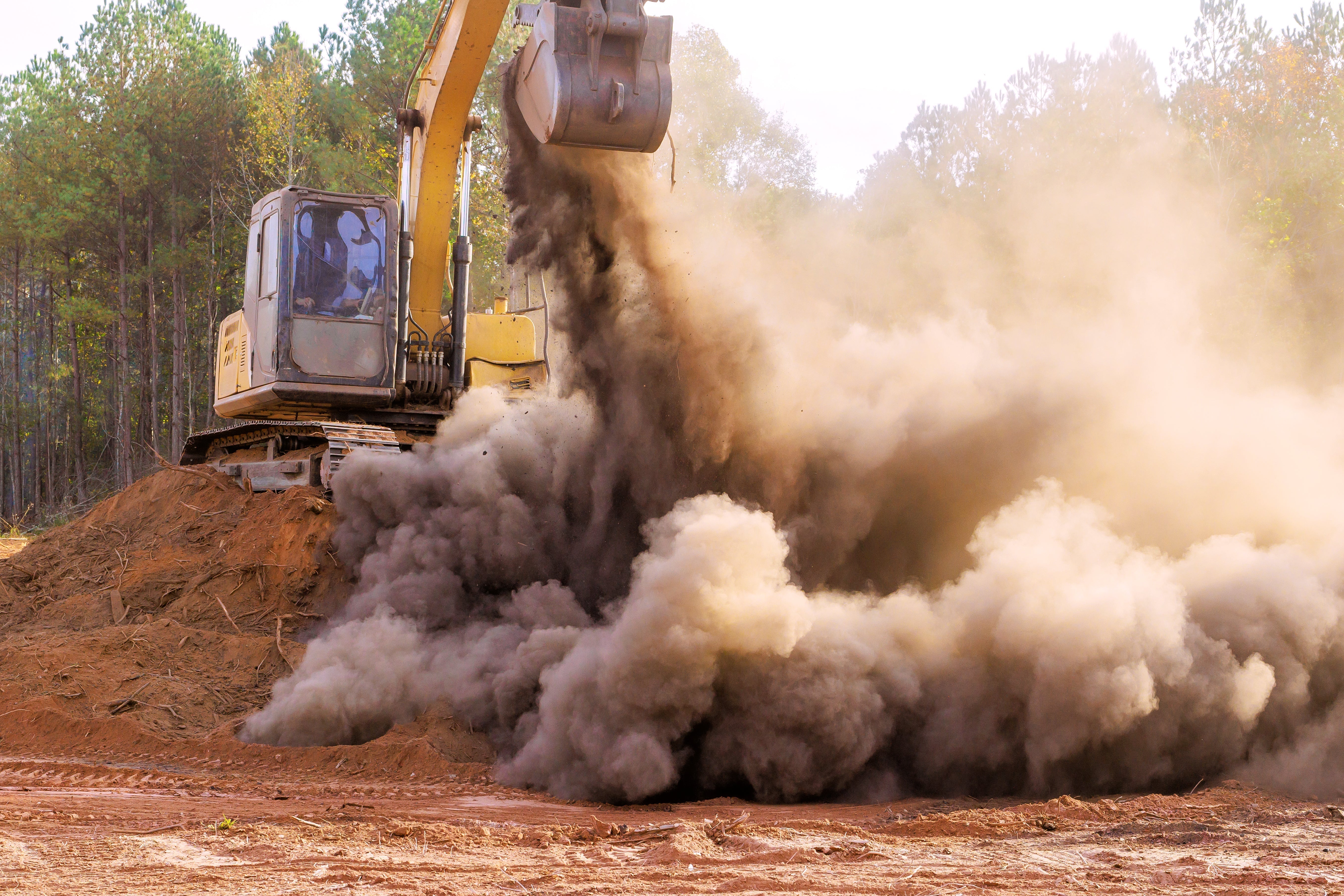 https://airdogusa.com/cdn/shop/articles/heavy-machinery-clears-land-creating-dust-debris-2025-03-27-06-00-58-utc.jpg?v=1772436042